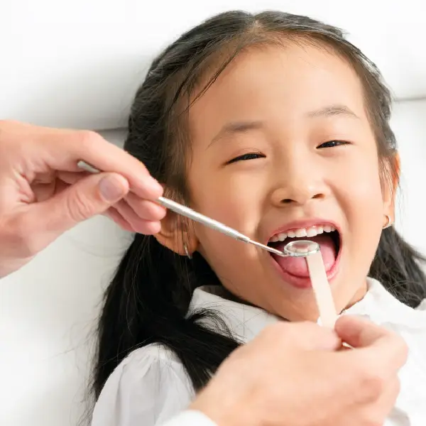 child during a dental checkup.